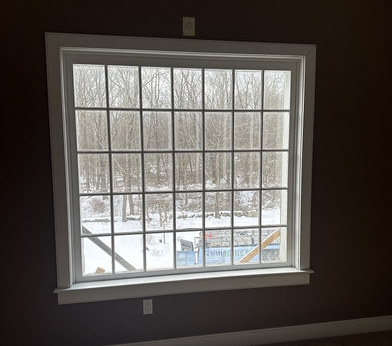 Old wood window in Redding allows cold air inside